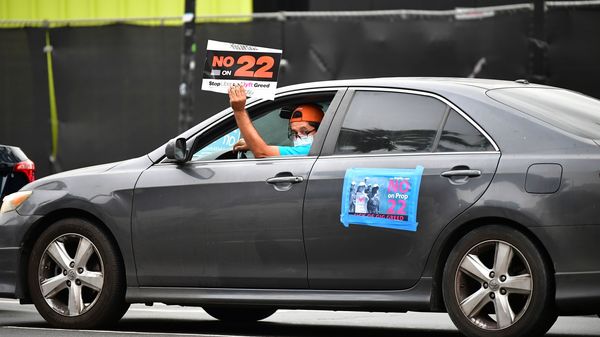 A California ballot measure over whether Uber and Lyft should treat their drivers as employees divided gig workers but was approved by voters.