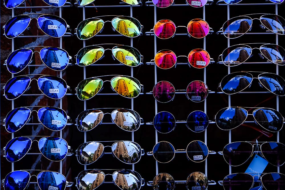 sell sunglasses online colorful aviator hanged on rack