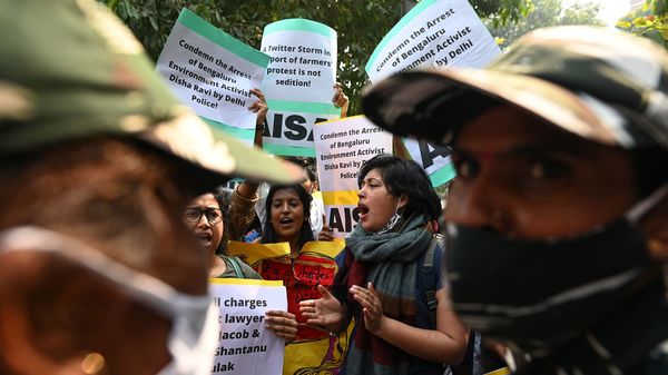 Demonstrators in New Delhi shout slogans during a protest against the arrest of climate change activist Disha Ravi for allegedly helping to create a guide for anti-government farmers protests.