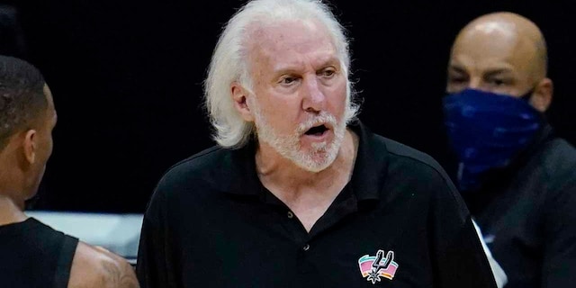 San Antonio Spurs coach Gregg Popovich, center, yells from the sideline during the fourth quarter of the team's NBA basketball game against the Los Angeles Clippers on Tuesday, Jan. 5, 2021, in Los Angeles. (AP Photo/Ashley Landis)