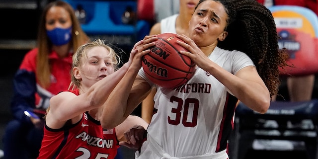 Stanford guard Haley Jones (30) drives to the basket over Arizona forward Cate Reese (25) during the first half of the championship game in the women's Final Four NCAA college basketball tournament, Sunday, April 4, 2021, at the Alamodome in San Antonio. (AP Photo/Eric Gay)