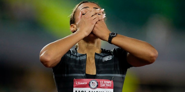 Sydney McLaughlin reacts after setting a new world record in the finals of the women's 400-meter hurdles at the U.S. Olympic Track and Field Trials Sunday, June 27, 2021, in Eugene, Ore. (AP Photo/Ashley Landis)