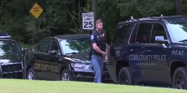 Police are seen at Pinetree Country Club, in Atlanta’s Cobb County