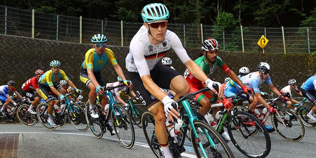 Dmitriy Gruzdev of Kazakhstan, Nikias Arndt of Germany and Mohcine El Kouraji of Morocco compete in the men's cycling road race at the 2020 Summer Olympics, Saturday, July 24, 2021, in Oyama, Japan. (Tim de Waele/Pool Photo via AP)