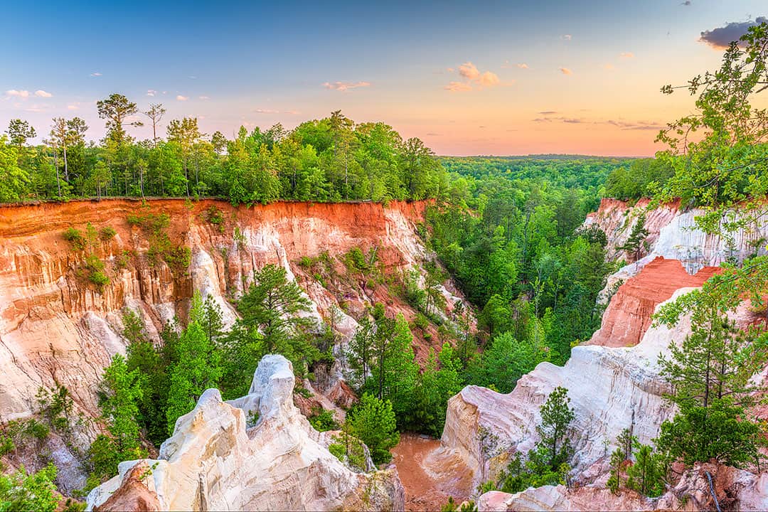 Providence Canyon State Park is also referred to as the “Little Grand Canyon” of Georgia. It offers the most picturesque views with tones of orange, pink, and red