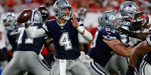 Dallas Cowboys quarterback Dak Prescott (4) throws a pass against the Tampa Bay Buccaneers during the first half of an NFL football game Thursday, Sept. 9, 2021, in Tampa, Fla. (AP Photo/Scott Audette)