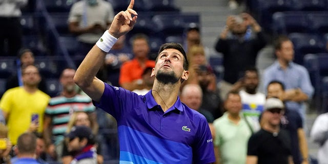 Novak Djokovic, of Serbia, motions and looks up after defeating Matteo Berrettini, of Italy, during the quarterfinals of the U.S. Open tennis tournament Thursday, Sept. 9, 2021, in New York. (AP Photo/Frank Franklin II)