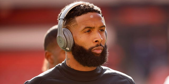 Cleveland Browns wide receiver Odell Beckham Jr. walks off of the field prior to the start of an NFL football game against the Pittsburgh Steelers, Sunday, Oct. 31, 2021, in Cleveland. 