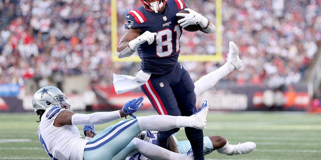 Jonnu Smith (81) of the New England Patriots runs with the ball against Trevon Diggs (7) of the Dallas Cowboys in the first quarter at Gillette Stadium Oct. 17, 2021 in Foxborough, Mass.