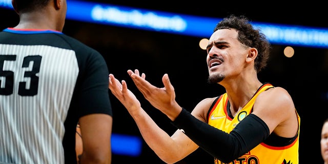 Atlanta Hawks guard Trae Young reacts after a call during the first half of the team's NBA basketball game against the Utah Jazz on Thursday, Nov. 4, 2021, in Atlanta.