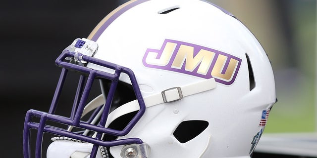 A James Madison Dukes helmet on the sidelines prior to a game between the Dukes and the Richmond Spiders on Oct. 16, 2021, at E. Claiborne Robins Stadium in Richmond, Virginia.
