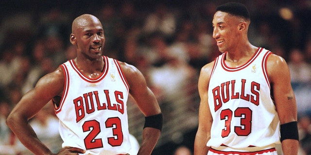 Michael Jordan (left) and Scottie Pippen of the Chicago Bulls talk during the final minutes of their game May 22, 1997, in the NBA Eastern Conference finals against the Miami Heat at the United Center in Chicago, Illinois. The Bulls won the game 75-68 to lead the series 2-0.