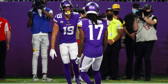 Minnesota Vikings wide receiver Adam Thielen (19) celebrates with teammate K.J. Osborn (17) after catching a 20-yard touchdown pass during the first half of an NFL football game against the Dallas Cowboys, Sunday, Oct. 31, 2021, in Minneapolis.