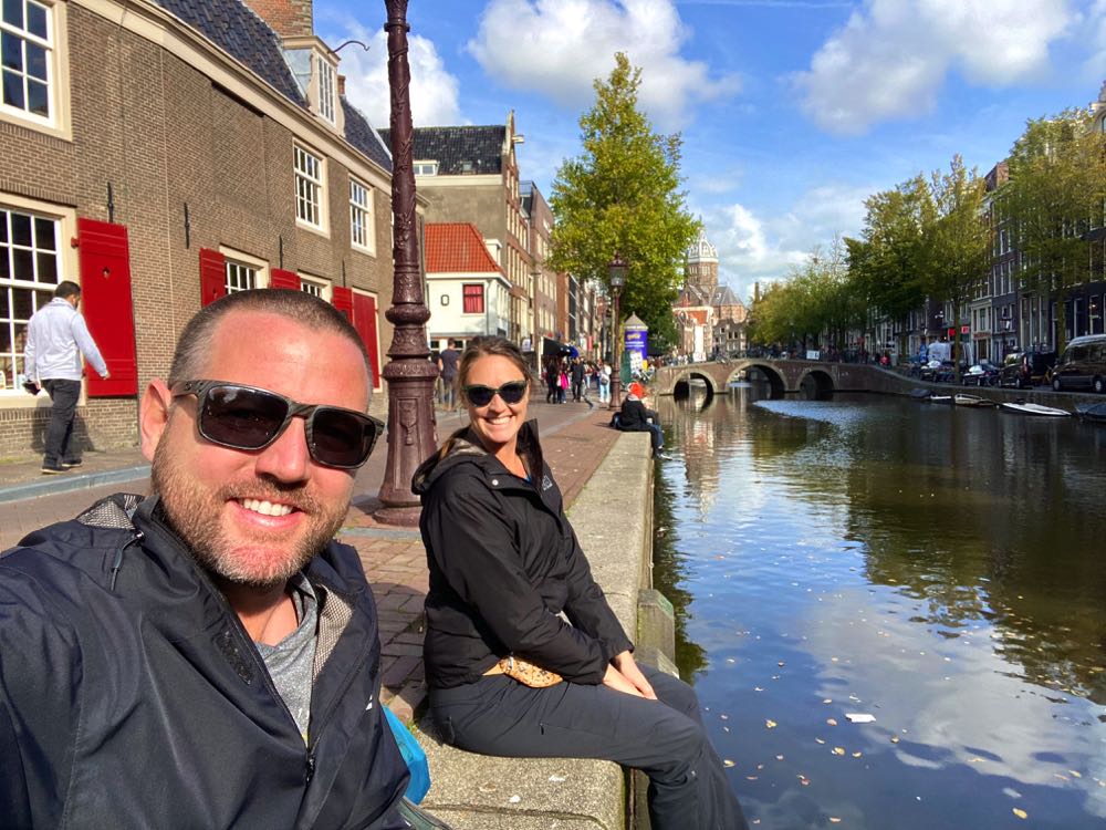sitting by the canal in amsterdam