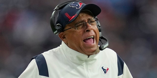 Houston Texans head coach David Culley questions a call during the first half of an NFL football game against the Tennessee Titans, Sunday, Jan. 9, 2022, in Houston.