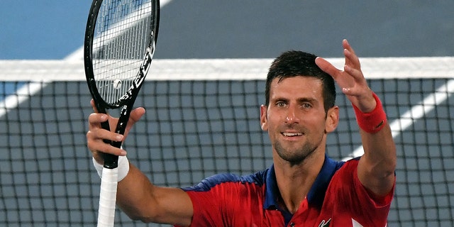 Serbia's Novak Djokovic celebrates beating Japan's Kei Nishikori during their Tokyo 2020 Olympic Games men's singles quarterfinal tennis match at the Ariake Tennis Park in Tokyo on July 29, 2021. (Photo by Tiziana FABI / AFP) (Photo by TIZIANA FABI/AFP via Getty Images)