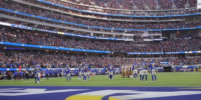 The San Francisco 49ers offense huddles during the game against the Los Angeles Rams on Jan. 9, 2022, in Inglewood, California.