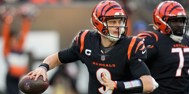 Cincinnati Bengals quarterback Joe Burrow throws during the first half of an NFL wild-card playoff football game against the Las Vegas Raiders, Saturday, Jan. 15, 2022, in Cincinnati.