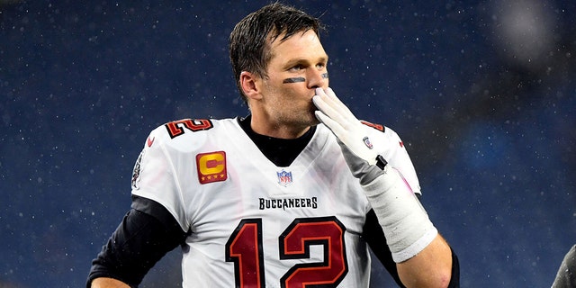 Tampa Bay Buccaneers quarterback Tom Brady blows a kiss to fans after a game against the New England Patriots at Gillette Stadium.