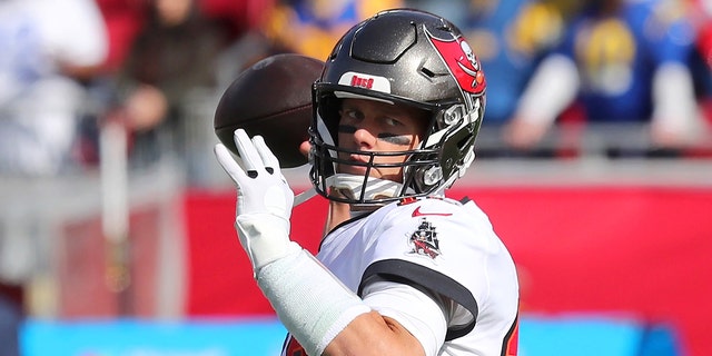 Tampa Bay Buccaneers quarterback Tom Brady warms up before an NFC divisional game between the Los Angeles Rams and the Tampa Bay Buccaneers Jan. 23, 2022, at Raymond James Stadium in Tampa, Fla.