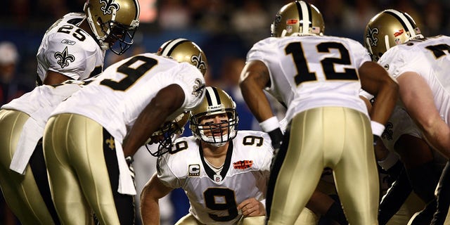 Quarterback Drew Brees (9) of the New Orleans Saints huddles with his team against the Indianapolis Colts during the Super Bowl Feb. 7, 2010, at Sun Life Stadium in Miami Gardens, Fla.