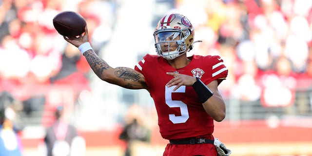 San Francisco 49ers quarterback Trey Lance (5) passes against the Houston Texans during the first half of an NFL football game in Santa Clara, Calif., Sunday, Jan. 2, 2022.
