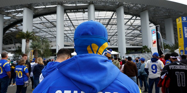 Los Angeles Rams fans get ready for the game between the Los Angeles Rams and the Arizona Cardinals in the NFC Wild Card Playoff game at SoFi Stadium on January 17, 2022 in Inglewood, California.