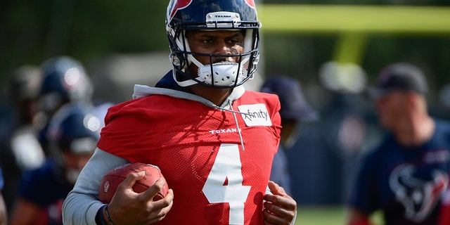 Texans quarterback Deshaun Watson runs drills with the team during practice July 29, 2021, in Houston. 