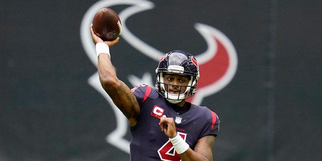 In this Dec. 27, 2020, file photo, Houston Texans quarterback Deshaun Watson throws a pass against the Cincinnati Bengals in Houston. 