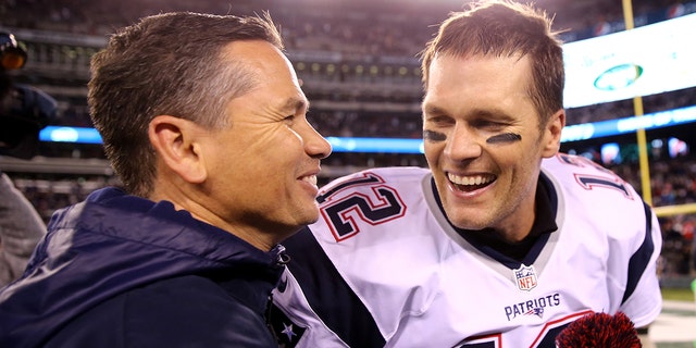 Tom Brady of the New England Patriots celebrates with trainer Alex Guerrero after defeating the New York Jets, 22-17, at MetLife Stadium on Nov. 27, 2016, in East Rutherford, New Jersey.