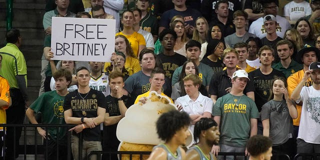A fan in the stands holds up sign saying "Free Brittney" during the second half of an NCAA college basketball game between Iowa State and Baylor in Waco, Texas, Saturday, March 5, 2022.