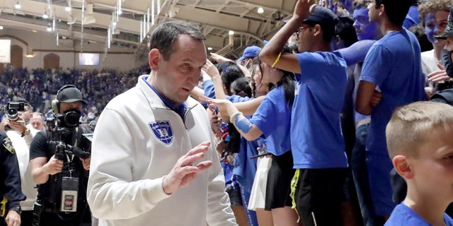 Duke coach Mike Krzyzewski walks off the floor following a tribute in his honor after the team's NCAA college basketball game against North Carolina, Saturday, March 5, 2022, in Durham, N.C. Krzyzewski, who is retiring after the season, coached his final game at Cameron Indoor Stadium. 