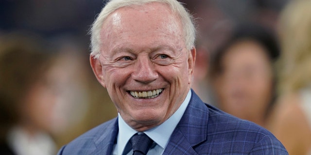 Dallas Cowboys owner Jerry Jones smiles before the team's NFL football game against the Houston Texans in Houston. 