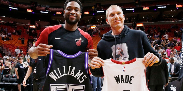 Dwyane Wade of the Miami Heat exchanges jersey with former Miami Heat player Jason Williams after the game against the LA Clippers at American Airlines Arena on Jan. 23, 2019, in Miami, Florida. 
