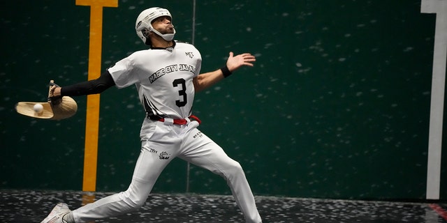 Chris Bueno returns a ball in a Jai Alai match at the Magic City Casino fronton, Sunday, March 13, 2022, in Miami.