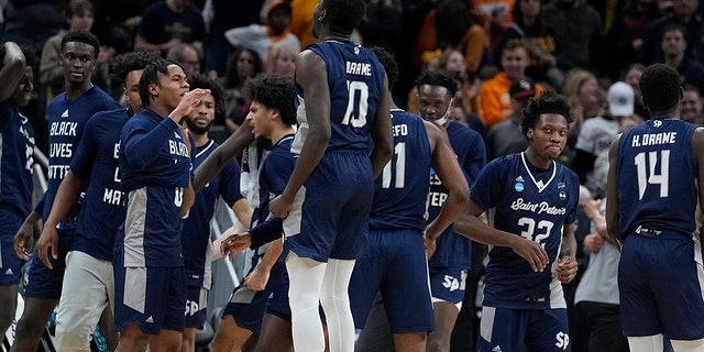 Saint Peter's players celebrate after defeating Murray State in a college basketball game in the second round of the NCAA tournament, Saturday, March 19, 2022, in Indianapolis. 