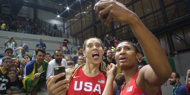 Brittney Griner and Angel McCoughtry take pictures for fans after the USA Vs Spain Women's Basketball Tournament on Aug. 8, 2016 in Rio de Janeiro, Brazil.