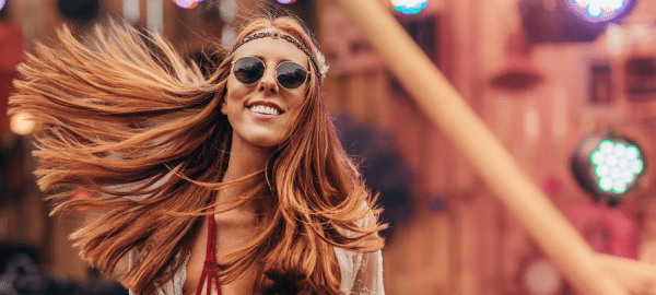 Red haired woman with sunglasses and a headband one