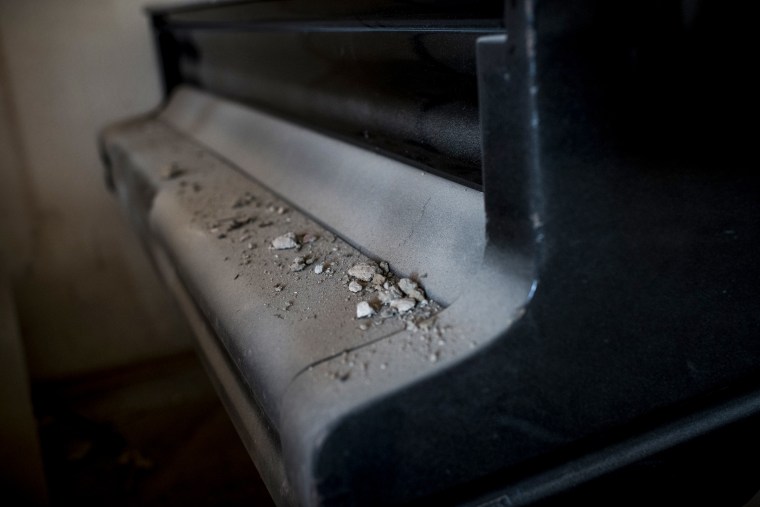 Debris lies on a piano, one of many rendered unusable by exposure to cold temperatures, at I.P. Kotlyarevsky Kharkiv National University of Arts on May 19, 2022.