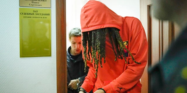 WNBA star and two-time Olympic gold medalist Brittney Griner leaves a courtroom after a hearing, in Khimki just outside Moscow, Russia, Friday, May 13, 2022.