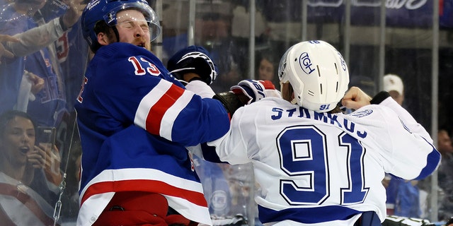 Steven Stamkos #91 of the Tampa Bay Lightning fights with Alexis Lafrenière #13 of the New York Rangers at the end of the third period in Game Five of the Eastern Conference Final of the 2022 Stanley Cup Playoffs at Madison Square Garden on June 09, 2022 in New York City.