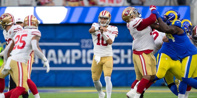 Jimmy Garoppolo (10) of the San Francisco 49ers passes during a game against the Los Angeles Rams at SoFi Stadium Jan. 30, 2022, in Inglewood, Calif. 