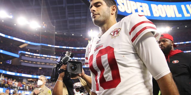 Jimmy Garoppolo of the San Francisco 49ers walks off the field after being defeated by the Los Angeles Rams in the NFC Championship Game at SoFi Stadium Jan. 30, 2022, in Inglewood, Calif.