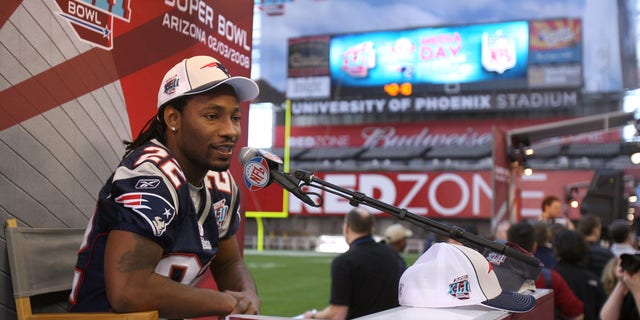 New England Patriots cornerback Asante Samuel speaks to reporters during Media Day for Super Bowl XLII at the University of Phoenix Stadium in Glendale, Ariz. on Jan. 29, 2008.