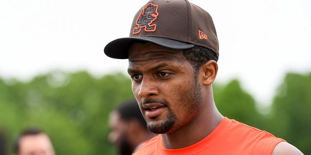 Deshaun Watson #4 of the Cleveland Browns walks off the field after the Cleveland Browns OTAs at CrossCountry Mortgage Campus on May 25, 2022 in Berea, Ohio.