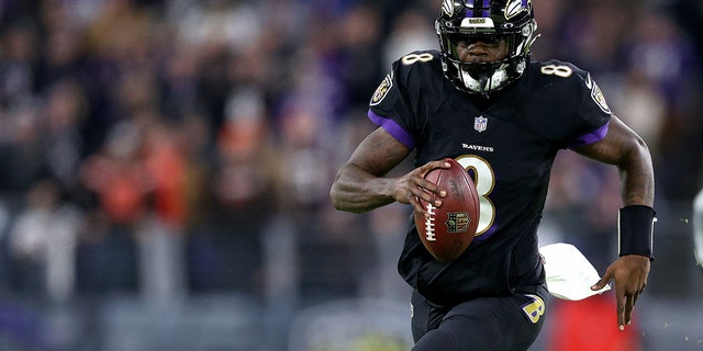 Lamar Jackson #8 of the Baltimore Ravens passes during a game against the Cleveland Browns at M&amp;T Bank Stadium on November 28, 2021 in Baltimore, Maryland.