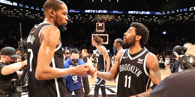 Kevin Durant and Kyrie Irving during the Brooklyn Nets-Cleveland Cavaliers game on April 12, 2022, at the Barclays Center.