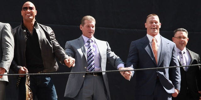 The Rock, Vince McMahon, John Cena and Michael Cole attend the WrestleMania 29 press conference at Radio City Music Hall April 4, 2013, in New York City.  