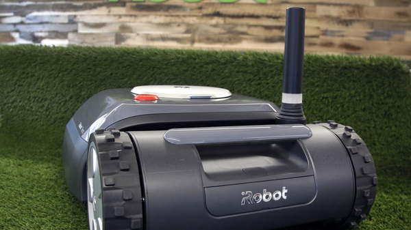 An iRobot Terra lawn mower is shown in Bedford, Mass., on Jan. 16, 2019. Amazon on Friday announced an agreement to acquire iRobot for approximately $1.7 billion. iRobot sells its robots worldwide and is most famous for the circular-shaped Roomba vacuum.