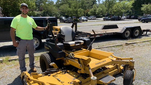 Austin Acocella, co-owner of Acocella Landscaping in Westchester County, N.Y., is holding onto his gas-powered mowers. He says electric ride-ons are too expensive for him to switch right now.